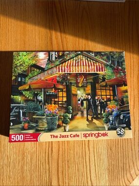 Springbok The Jazz Cafe 500-Piece Puzzle — Vibrant Red & Yellow Cafe Scene